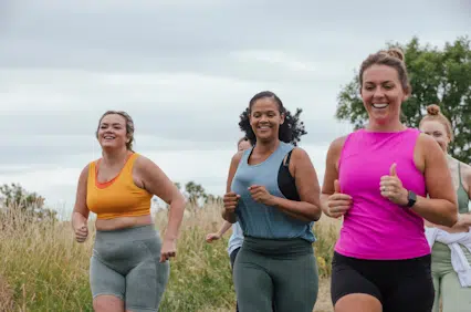 Happy women participating in BetterTogether weight loss challenge outdoors