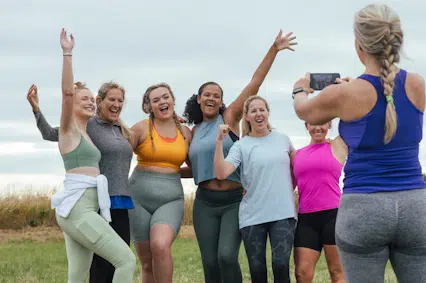 Happy women participating in the BetterTogether weight loss challenge outdoors